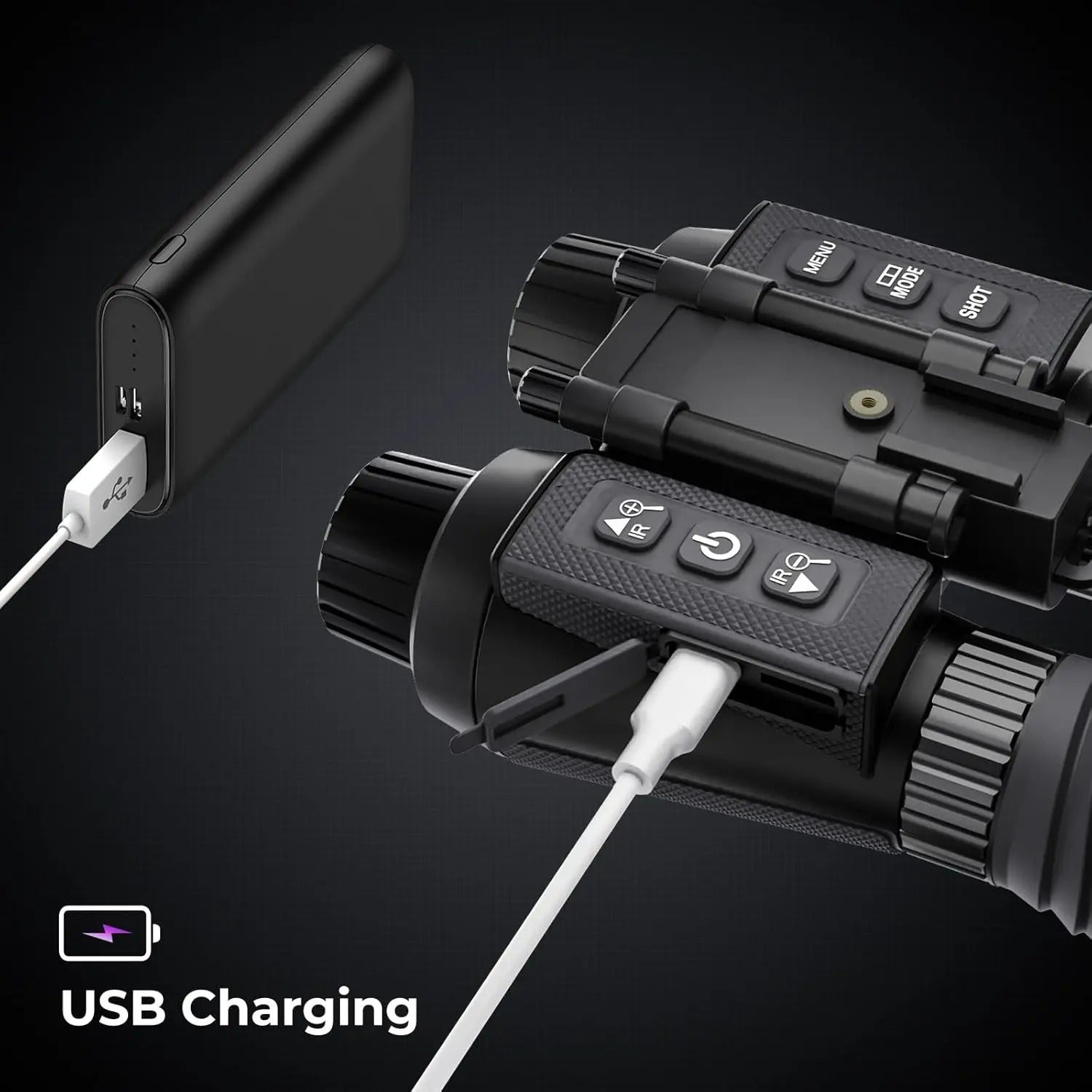 Black electronic device being charged via USB cable on a dark background